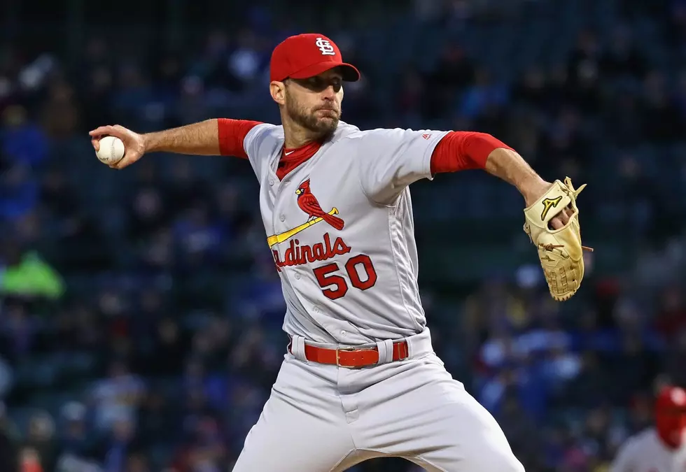 Wainwright pitches Cardinals past Cubs at chilly Wrigley
